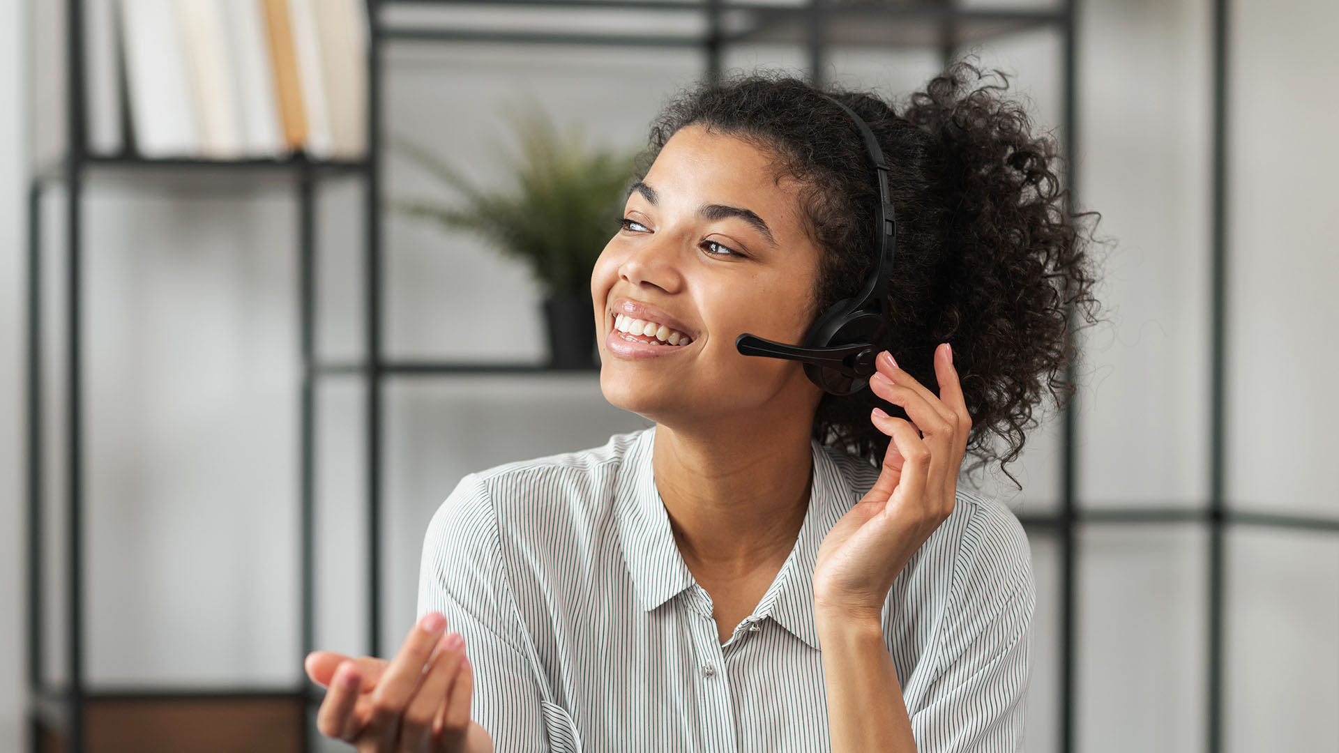 Lady on headset providing student services