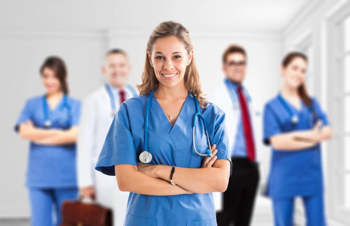 Large Group Female Nurses Working Together Stock Photo by