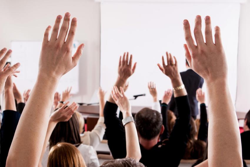 Learners raising their hands