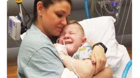 Photo of nurse snuggling boy goes viral